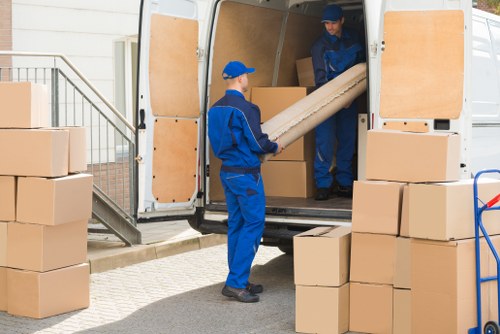 Removal team planning a house move in Twickenham with boxes and furniture