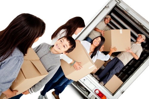 Furniture removals team planning a move in a Twickenham residential street