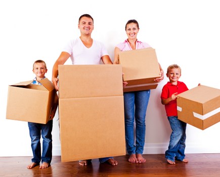 Removal team loading boxes during a domestic move