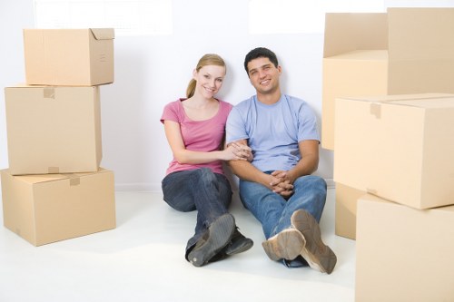 Staff handling furniture carefully during a move
