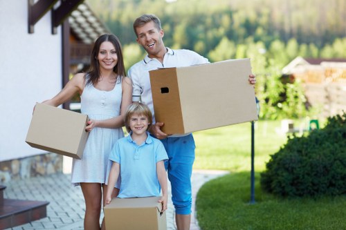 Packing boxes and wrapping household items for a move in Twickenham