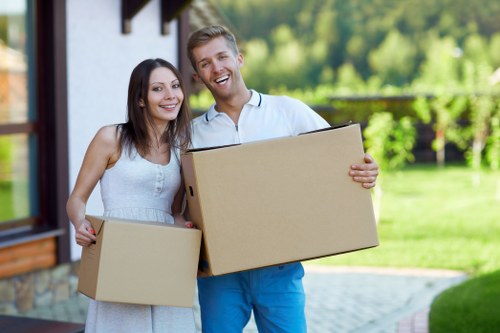 Office relocation equipment and boxed items prepared by a local removals team